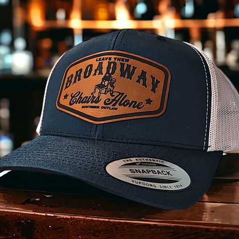 LEAVE THEM BROADWAY CHAIRS ALONE LEATHER TRUCKER HAT